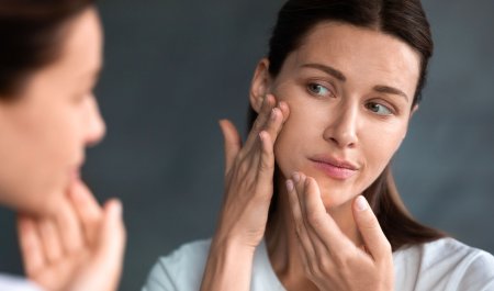 sebium_maskne-women-checking-acne-mirror